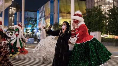 Performers with their Christmas costume entertain crowd at the EXPO 2020 Dubai. Leslie Pableo for The National