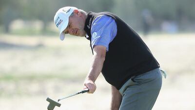 Paul Lawrie of Scotland hits a birdie putt on the seventh hole during the second round of the Commercial Bank Qatar Masters at Doha Golf Club on January 28, 2016 in Doha, Qatar. (Photo by Andrew Redington/Getty Images)