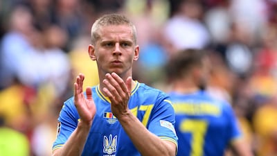 Ukraine's Oleksandr Zinchenko applauds fans after the match. Reuters