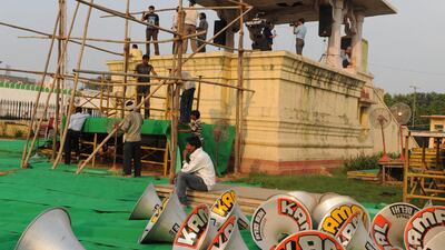 Laborers prepare the venue for Indian social activist Anna Hazare's 15-day public fast at Ramlila ground in New Delhi on August 18, 2011. A planned 15-day public fast by Indian anti-corruption activist Anna Hazare was postponed to prepare the venue in New Delhi for the crowds of supporters expected to attend. Hazare, who is currently in Delhi's Tihar jail, had been due to leave and begin his hunger strike at an open venue in the capital used for political rallies and festivals. AFP PHOTO / Prakash SINGH *** Local Caption *** 633074-01-08.jpg