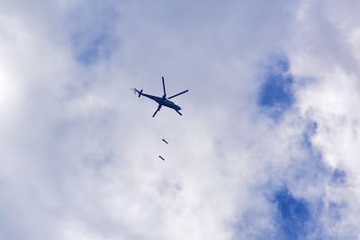 A Syrian air force Mi 24 helicopter dropping bombs over the Palestinian camp of Yarmouk, south of the Syrian capital Damascus. AFP