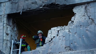 Rescuers at a Kyiv building damaged during the Russian drone strike. Reuters