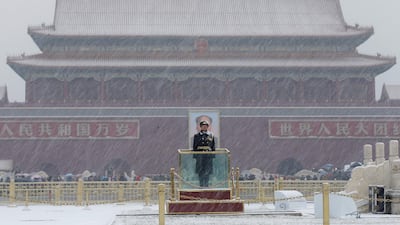 A paramilitary officer stands guard amid snow at the Tiananmen Square in Beijing, China. Reuters