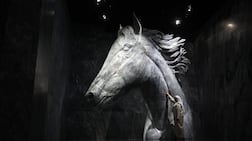 Tour guide Ahmed Gholam admires the statue of Dubai Millennium. The artwork at Vision Pavilion in Expo City, Dubai, is made from marble imported from Spain. It stands at 5.5 metres tall and weighs 52 tonnes. Chris Whiteoak / The National