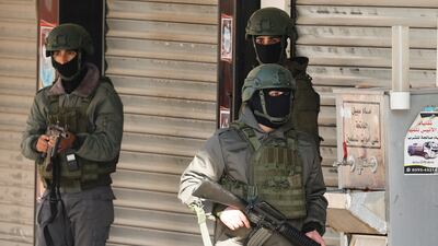 Palestinian security forces take position during clashes with militants at the Jenin refugee camp in the Israeli-occupied West Bank on Saturday. Reuters