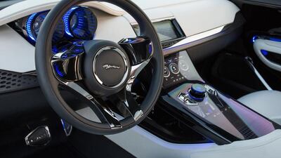 The interior offers interactive technology, with individual bucket seats for comfort. Courtesy Jaguar