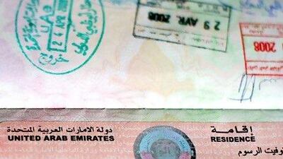 UAE Labour Law states that an employee should not bear the costs of residency visas and labour cards, but all too often employers add a clause to contracts stating that employees who leave within a certain time are liable to reimburse them. Andrew Parsons / The National