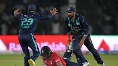 Shan Masood, right, and Mohammad Haris celebrate after England's Reece Topley is run out to seal Pakistan's victory in the fourth Twenty20 match in Karachi on September 25, 2022. AP