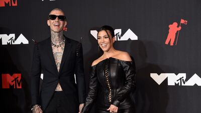 Travis Barker and Kourtney Kardashian arrive at the MTV Video Music Awards in New York. The couple announced their engagement this year. Invision / AP