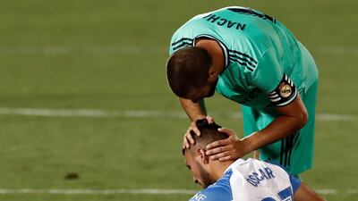 Leganes' Oscar is consoled by Real Madrid's Nacho. EPA