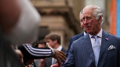 The Prince of Wales greets people during a visit to the Festival Site at Victoria Square. PA