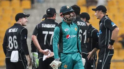 Pakistan batsman Shadab Khan walks back to the pavilion after his dismissal during the first ODI against New Zealand at Zayed Cricket Stadium in Abu Dhabi. AFP