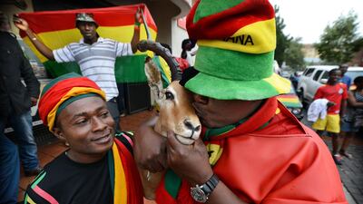 A Ghana supporter brought his mounted Springbok head for luck. Photo: Bram Lammers