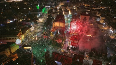 Fireworks illuminate Clock Square in Homs, western Syria, as the country marks the anniversary of the fall of the Assad regime. AP