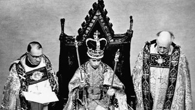 Queen Elizabeth wearing the St Edward Crown and carrying the sceptre and rod after her coronation.