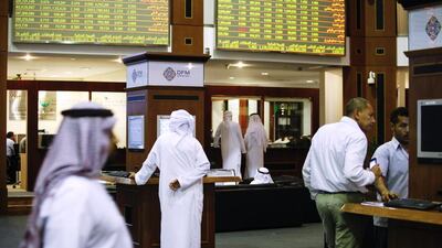 The Dubai Financial Market, above, has risen about 79.3 per cent so far this year. Sarah Dea / The National