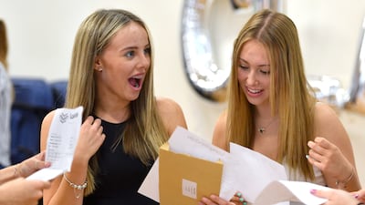 Megan Brough and Isabella Chisnall react as students receive their GCSE results at Longdendale High School in 2022 in Hyde, Greater Manchester. Getty Images