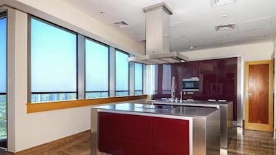 The kitchen of this five-bedroom penthouse at Ocean Heights comes with a beautiful scenery of Dubai Marina. Courtesy Christie’s International Real Estate