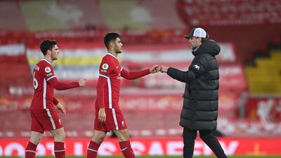 Liverpool's manager Jurgen Klopp, right, with his players at the end of the match. AP