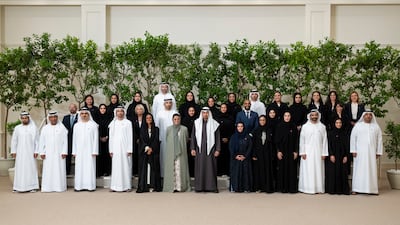 Sheikh Mohamed with the team, including Rawdha Al Qubaisi, head of the creative projects section at the National Projects Office in the Presidential Court and Sultan Al Amimi
