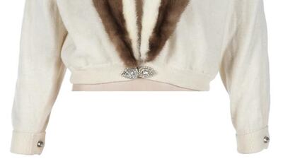 Marilyn Monroe's white wool cardigan with lace and tulle lining. A removable two-tone mink shawl collar lapel attaches with small snaps. Courtesy Julien's Auctions