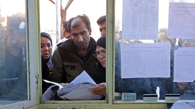 Relatives check lists of the dead at a hospital in Kerman, Irab following a stampede at Qasem Suleimani's funeral on January 7, 2020 that left at least 56 people dead. Carnage accompanied the late Quds Force commander to the grave. AFP