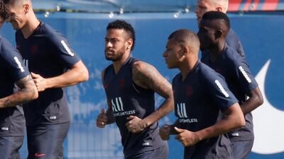Neymar with Kylian Mbappe and teammates during training. Reuters