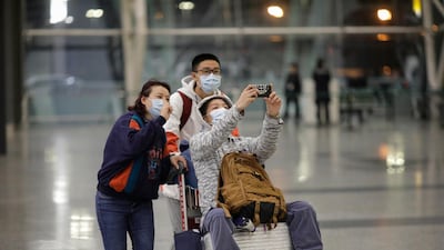 Passengers wear masks at Guangzhou airport in Guangzhou, Guangdong Province, China. EPA