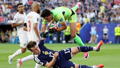 Morocco goalkeeper Yassine Bounou (top) and Scotland's Ben Gannon-Doak in action during the FIFA World Cup 2026 group stage match between Scotland and Morocco at Boston Stadium in Foxborough, Massachusetts, USA. EPA