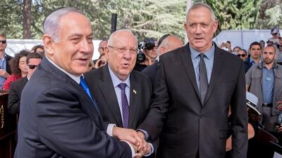 Likud leader Benjamin Netanyahu, left, Israeli President Reuven Rivlin, centre, and Benny Gantz, leader of Blue and White coalition, attend a memorial ceremony in Jerusalem in September. AFP