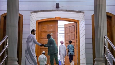 Worshippers go to a mosque close to the Sheikh Zayed Grand Mosque for Fajr on the first day of Ramadan. Victor Besa / The National