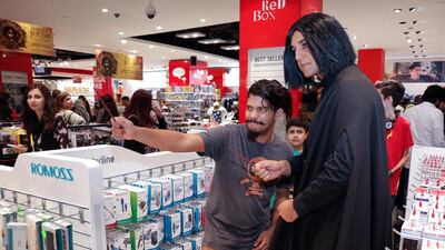 A fan poses with another fan cosplayed as Professor Severus Snape at the Harry Potter and the Cursed Child book launch at the Mall of the Emirates. Victor Besa for The National
