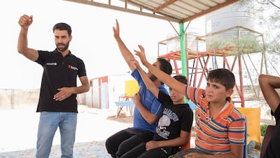 At the centre, Ali and his friend Tarek attend a drop-in session for child labourers who are provided with informal education activities and technical skills