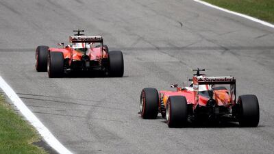 Ferrari’s Sebastian Vettel, left, drives ahead of teammate Kimi Raikkonen during the Formula One Italian Grand Prix. Gabriel Bouys / AFP