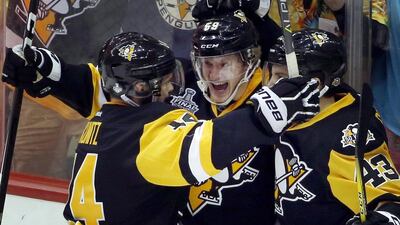 Pittsburgh Penguins' Jake Guentzel, centre, celebrates after scoring a goal against the Nashville Predators in Wednesday's Game 2 of the Stanley Cup Finals in Pittsburgh, Pennsylvania. Gene J Puskar / AP Photo
