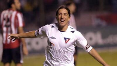 Quito's Damian Manso celebrates his goal against Estudiantes during the Copa Libertadores. The Argentine's team shocked South American football by becoming the first side from Ecuador to win the competition.