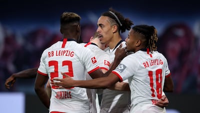 Leipzig's Danish forward Yussuf Poulsen, second right, scoring his team's third goal against Augsburg. AFP