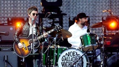 Noel Gallagher, left, and Jeremy Stacey of Noel Gallagher's High Flying Birds perform at the 2012 Coachella festival in California. Kevin Winter / Getty Images for Coachella / AFP
