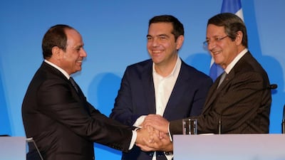Egyptian President Abdel Fattah El Sisi, left, Greek Prime Minister Alexis Tsipras, centre, and Cypriot President Nicos Anastasiades shake hands at a summit in Crete on October 10, 2018. Reuters