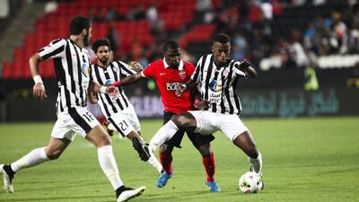 Ismail Al Hammadi, centre, created the penalty for Ahmed Khalil only for his teammate to miss from the spot. Lee Hoagland / The National