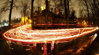 Christians carry candles outside a church during an Orthodox Easter midnight service in Saint Petersburg, Russia. AP Photo