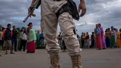 A Manipur policeman on duty as members of Meira Paibis block traffic to check vehicles for members from the rival tribal Kuki community, in Imphal, capital of Manipur. AP
