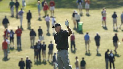Greg Norman of Australia waves after hitting his approach shot to the first green during first round play at the 2009 Masters golf tournament at the Augusta National Golf Club in Augusta, Georgia, April 9, 2009. REUTERS/Hans Deryk