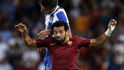 Roma’s Mohamed Salah (front) and Porto’s Alex Telles. Angelo Carconi / EPA