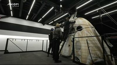 The boat crew preparing the capsule for opening