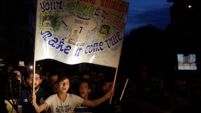 Real Madrid fans welcome their team to Kiev. Sergei Grits / AP Photo