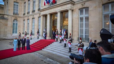 Mr Macron, Ms Macron, Mr Xi and Ms Peng at the steps of the Elysee Palace. Getty Images