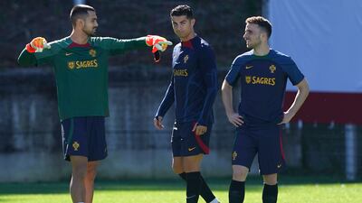 Portuguese goalkeeper Diogo Costa alongside Cristiano Ronaldo and Diogo Jota. EPA