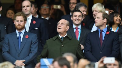 Prince Harry, Prince Philip and Prince William attend the Rugby World Cup final match between New Zealand against Australia at Twickenham in 2015. Reuters.