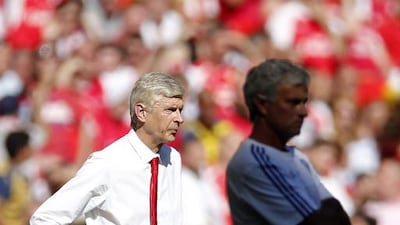 Arsenal manager Arsene Wenger and Chelsea manager Jose Mourinho (R). Reuters / Andrew Couldridge